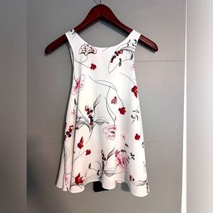 White backless blouse with red flower design